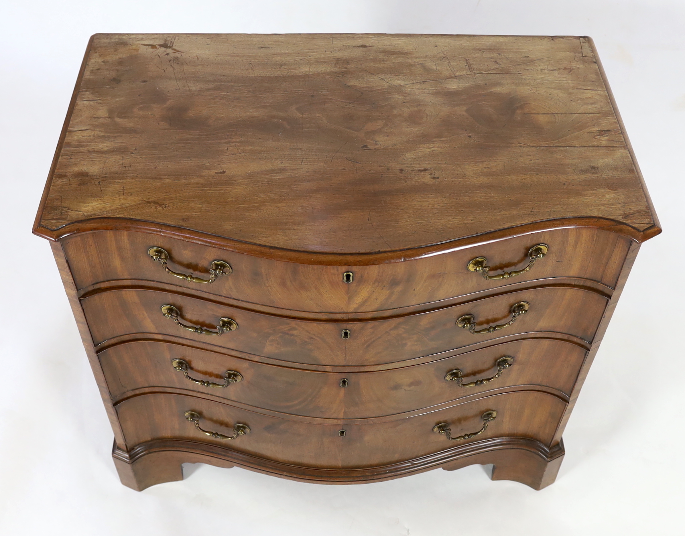 A George III mahogany serpentine dressing chest